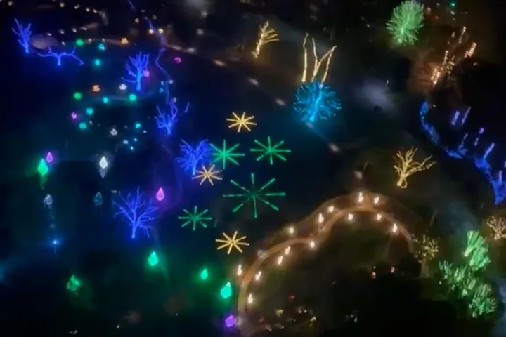 Colourful holiday light displays seen from a helicopter at night